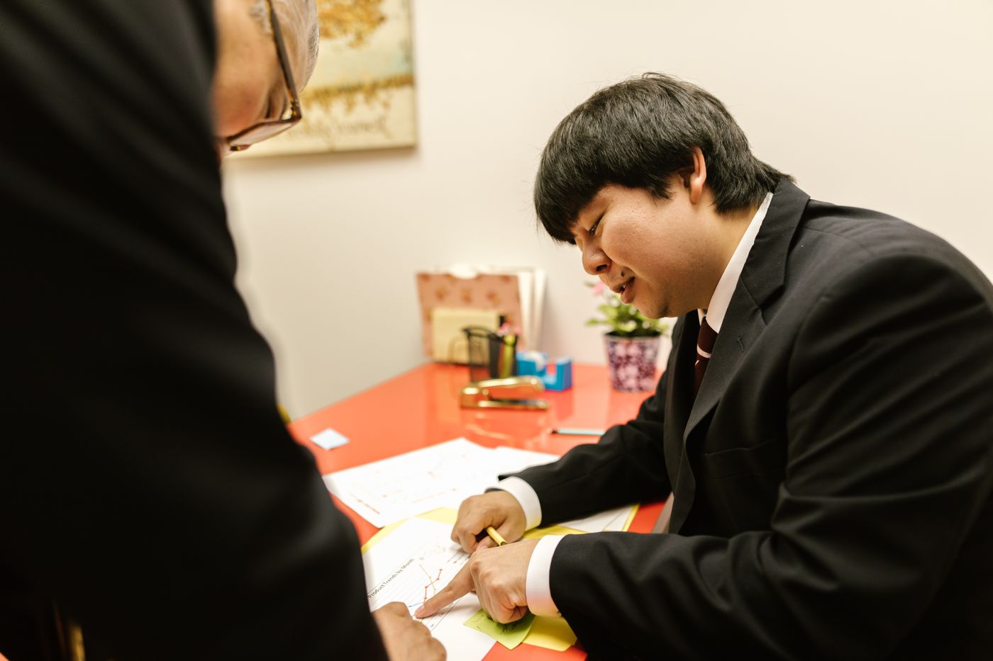 Two officers going through papers at a desk